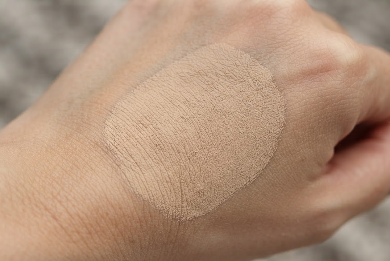 Close-up of a matte foundation swatch on skin showing a powdery, non-shiny finish.