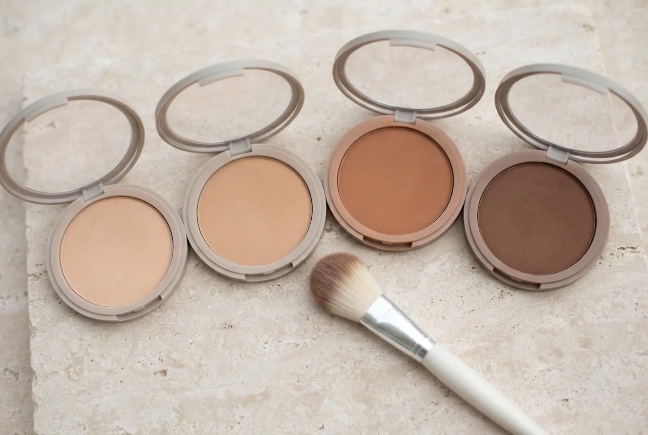 A lineup of several bronzer compacts in different shades from light to deep.