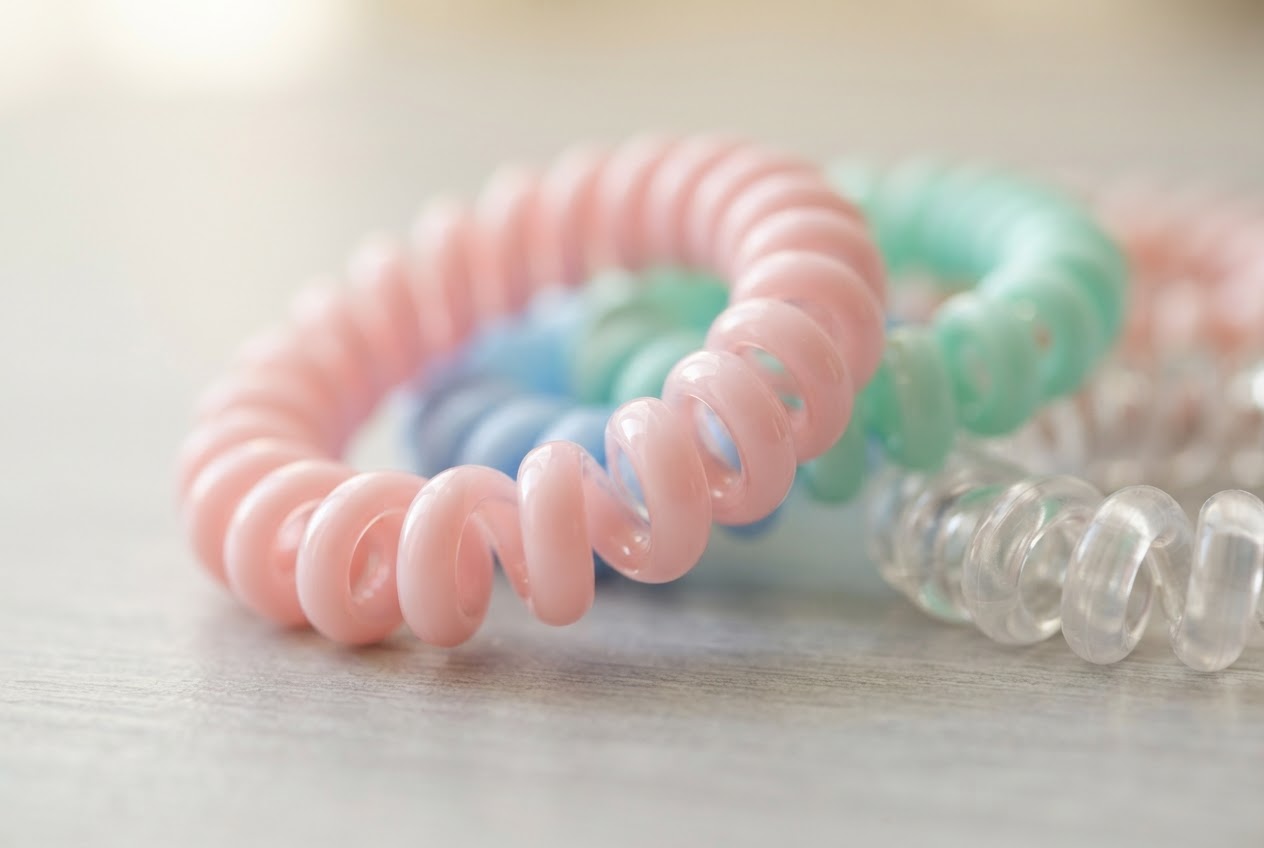 Close-up of spiral hair ties in pastel colors.
