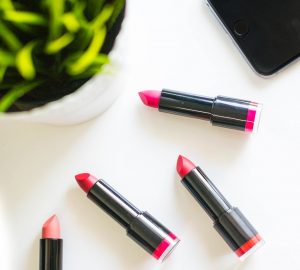 four assorted-color lipsticks
