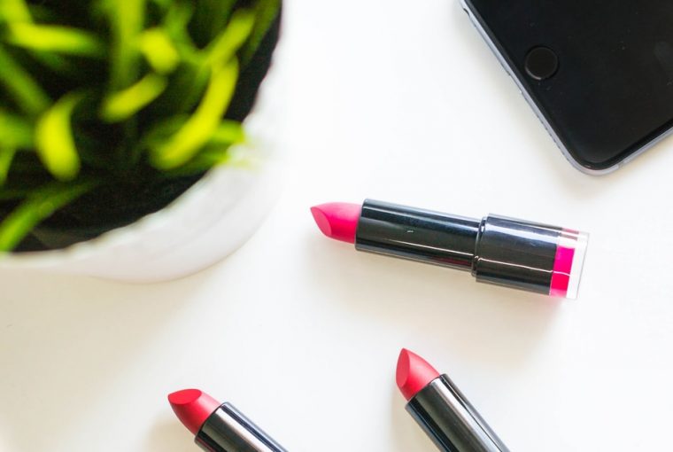 four assorted-color lipsticks