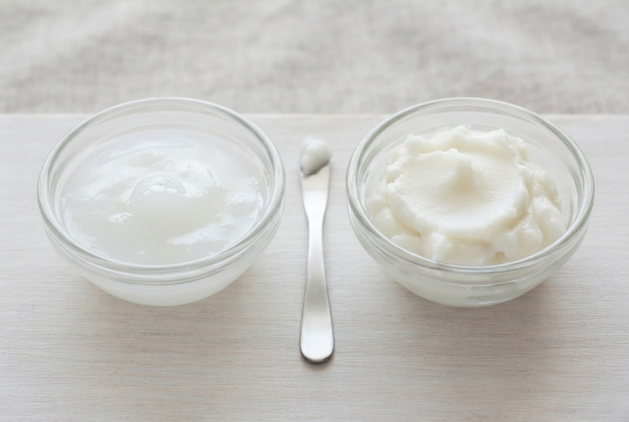 Two bowls with different cream consistencies: a light lotion and a thick salve.